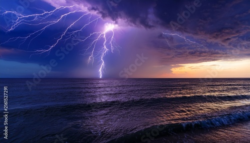 dramatic lightning storm over the ocean at dusk