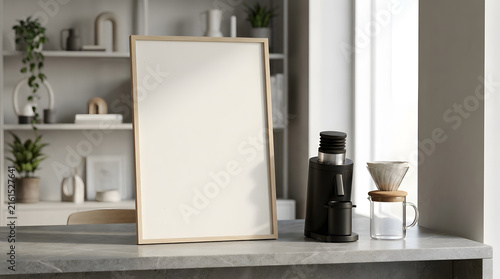 Blank vertical wooden picture frame mockup on a marble kitchen counter next to coffee brewing equipment and plants in a modern interior.