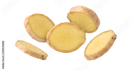 Fotografie Levitating fresh sliced ginger root pieces on transparent background