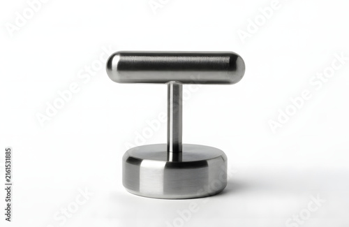 Stainless steel coffee tamper tool isolated on white background for espresso preparation.