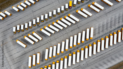 School buses parked in branching rows from directly above