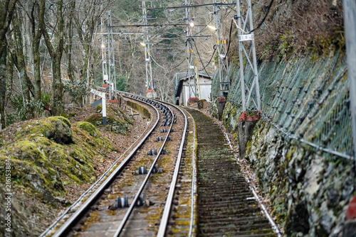 Quadro su tela Funicular railway track ascending steep forested slope at Mount Rokko in Kobe Ja