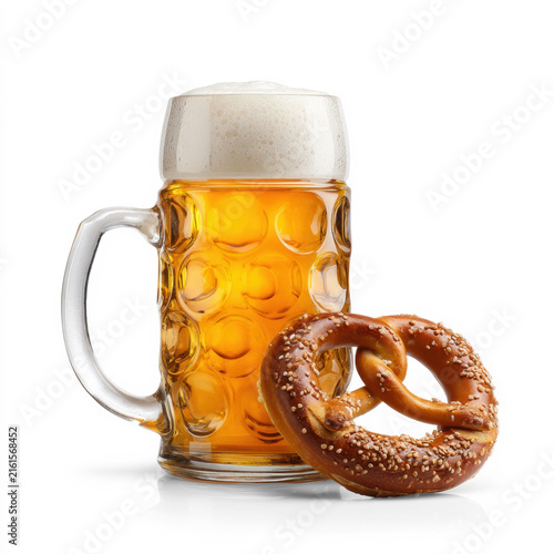 Frothy golden lager in dimpled glass beer stein with sesame pretzel isolated on transparent background