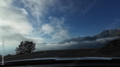 Driving through foggy clouds on Superbagneres mountain pass road in the Pyrenees