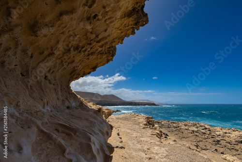 Rock formations and caves on the Atlantic Ocean coast in Ajuy, Fuerteventura, Canary Islands, wallpaper or background for your project
