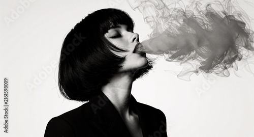Portrait of Woman Blowing Smoke Cloud, Black and White Minimalist Fashion Photography