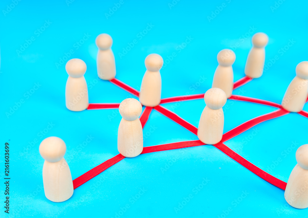 Obraz premium Wooden people connected through red lines showing teamwork and communication network on turquoise background 