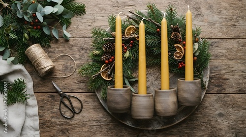 Arranging diy advent wreath comp on decorative shelf with soft