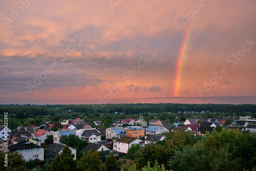 An evening rainbow outside the city after the rain.