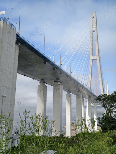 Grand Russky Bridge in Vladivostok under a clear blue sky