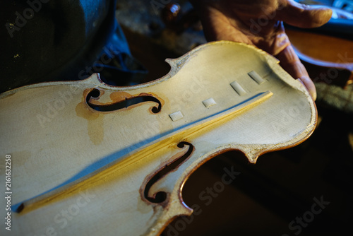 Obraz na płótnie Traditional Violin Maker Crafting a Handmade Instrument in the Harz Mountains, G