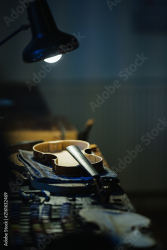 Obraz na plátně Traditional Violin Maker Crafting a Handmade Instrument in the Harz Mountains, G
