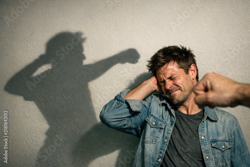 A person experiencing stress or frustration holds their head in their hands, often indicating emotional distress