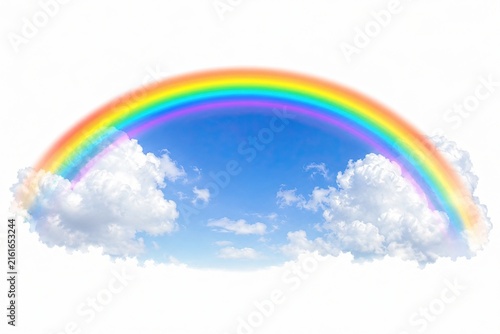 Colorful rainbow arch with white clouds in a bright blue sky