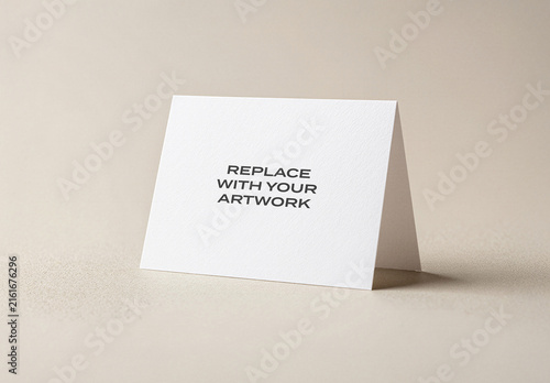 Folded card mockup standing upright on a neutral surface, realistic stationery presentation with text placeholder, clean design template for branding or print