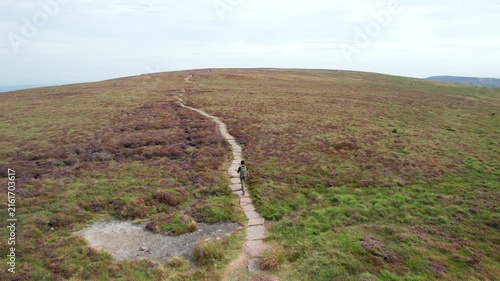 Backpacker hiker walking in Black Mountain and Twyn Llech, famous hiking location in Abergavenny, South Wales of UK.