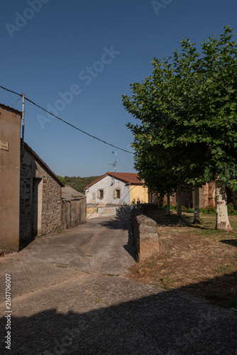 Quiet Village Street Lane with Old Stone Houses and Trees