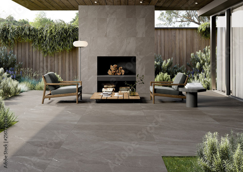Fotografía Luxury outdoor patio terrace with stone tile flooring and modern fireplace