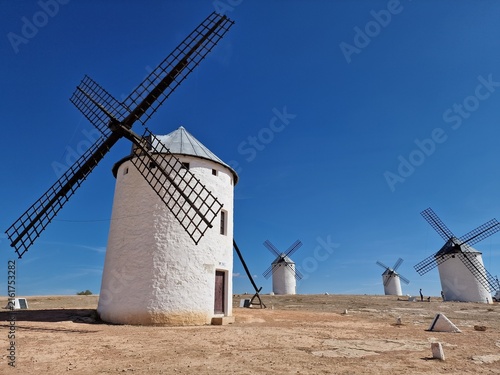 Iconic Spanish windmills standing on a dry hill in Campo de Criptana, Castilla-La Mancha