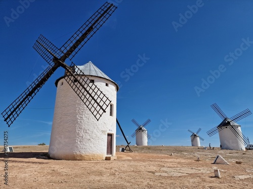 Obraz na plátne Iconic Spanish windmills standing on a dry hill in Campo de Criptana, Castilla-L