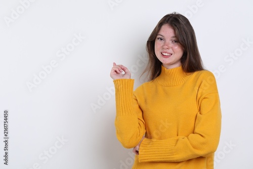 Fotografía Beautiful girl with freckles on white background, space for text