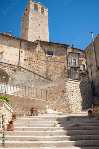 Pedestral staircase leading to the church bell tower on a sunny day in the charming village of Castel del Monte, Abruzzo, Italy.