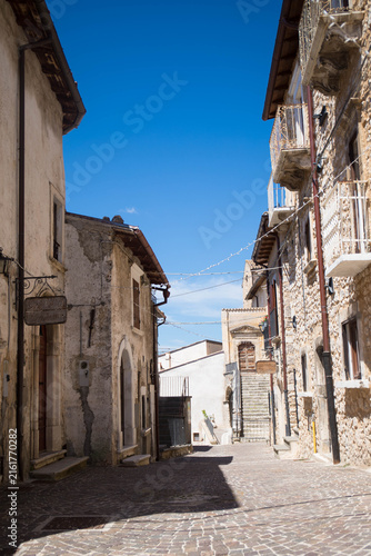 Empty road on a sunny day in the charming old village of Castel del Monte, Abruzzo, Italy.