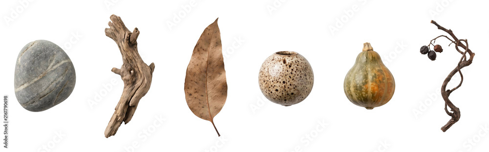 Fototapeta premium Curated collection of natural and handmade objects including a stone, driftwood, leaf, ceramic vase, gourd, and twig arranged in a horizontal line for a wabi-sabi concept
