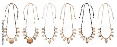 Collection of handmade seashell necklaces with cowrie shells, wooden beads, and adjustable cords in a bohemian beach style, showcasing a variety of summer accessory designs
