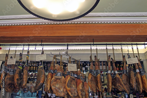 Картината върху платно Traditional Cured Ham Presunto Legs Hanging from Racks inside Manteigaria Silva