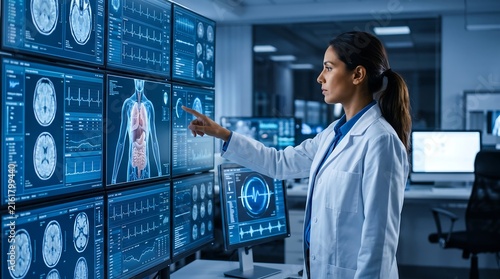 Professional female doctor analyzing advanced digital medical imaging and diagnostic data on large touchscreen displays in a futuristic hospital lab