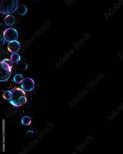 Vertical photo of glowing iridescent soap bubbles with colorful glitter on black background. Shiny transparent spheres with copy space
