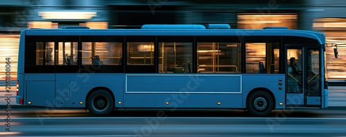 Blue bus in motion, blurred urban background with warm lights