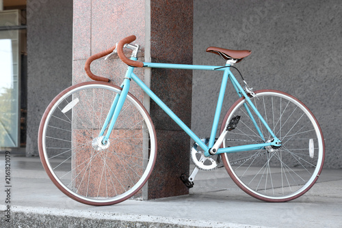 Konstfotografi Urban cycling and sustainable transportation, light blue fixed gear bicycle park