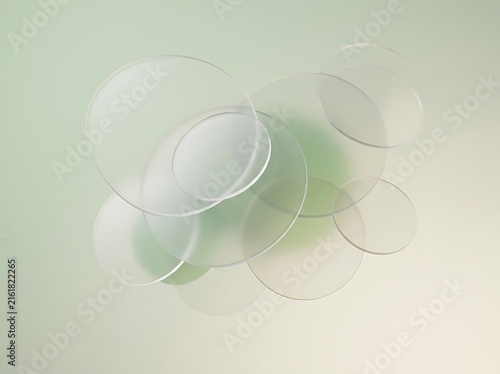 Overlapping translucent frosted acrylic discs on sage and cream gradient