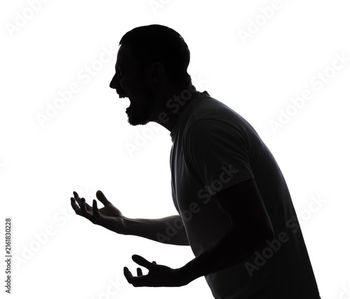Foto Silhouette of screaming young man on white background