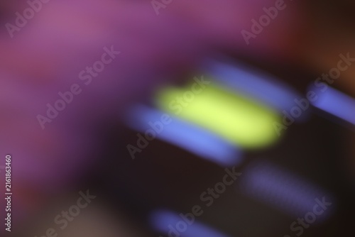 Close-up of colorful illuminated keys displaying vibrant purple yellow blue and black tones