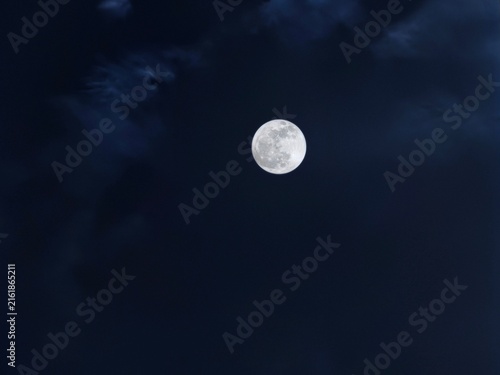 Quadro su tela ​Full moon glowing in dark blue night sky with copy space