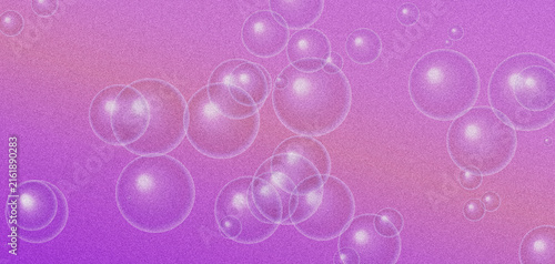 Transparent soap bubbles floating over vibrant pink and purple grainy background.