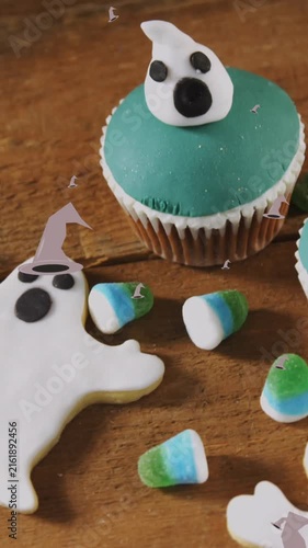 Animation of witch hat icons over halloween cakes