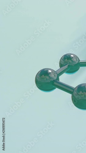 Animation of molecule model spinning over leaf shadow on green background