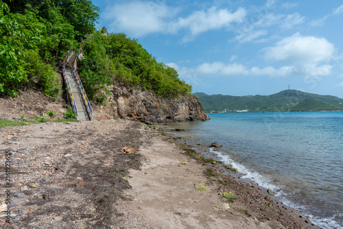 Undeveloped rocky shoreline and calm Caribbean water on Santa Catalina Island, Colombia