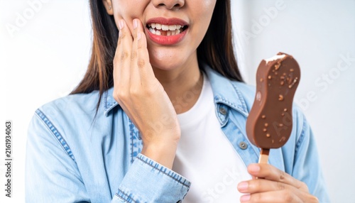 Woman with Sensitive Teeth Holding Ice Cream Bar and Experiencing Dental Pain