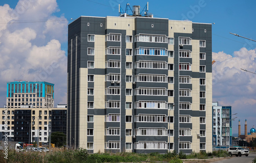 Contemporary multi-story residential building located in a newly developed neighborhood, reflecting modern architectural design and ongoing urban expansion. Ust-Kamenogorsk (Kazakhstan)