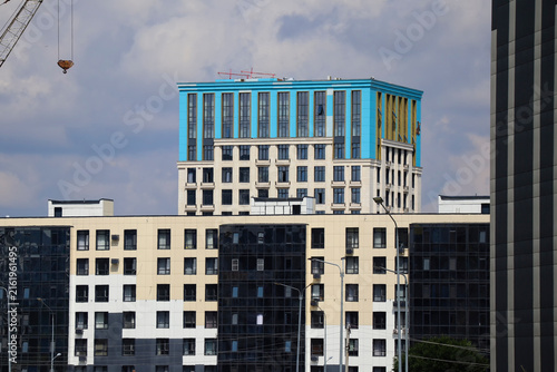 New apartment buildings in a modern residential district under an overcast sky, showcasing contemporary architecture and ongoing urban development. Urbanization. Ust-Kamenogorsk (Kazakhstan)