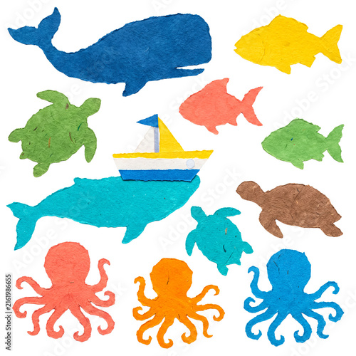 Photography Collection of diverse textured paper marine animals and a paper boat, isolated on a transparent background