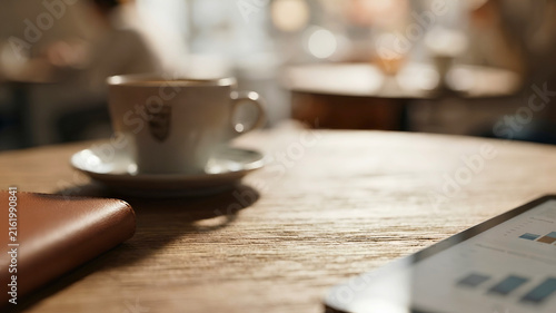 Morning coffee spot on the table at the cafe