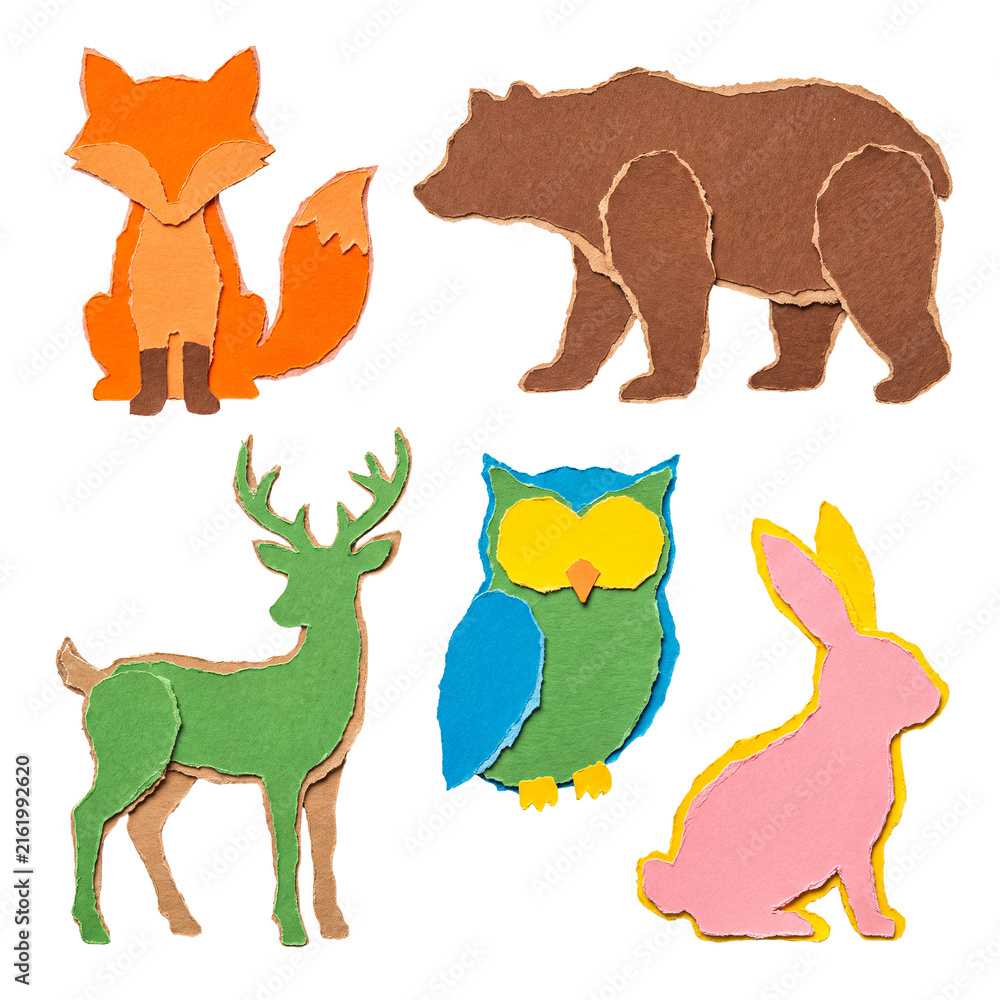 Naklejka premium Creative torn paper collage of woodland animals. Fox, bear, deer, owl, and rabbit isolated on transparent background.
