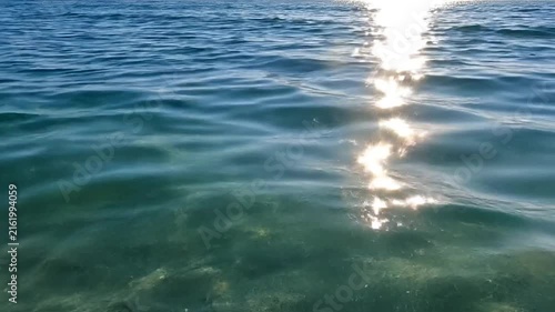 Ocean Surface With Sparkling Sunlight Reflections And Gentle Waves