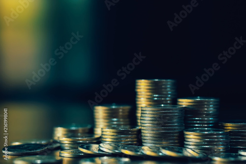 Coin stacks with generous copy space symbolize savings, investment, financial planning, wealth accumulation, passive income, capital growth, and long-term money management strategy.